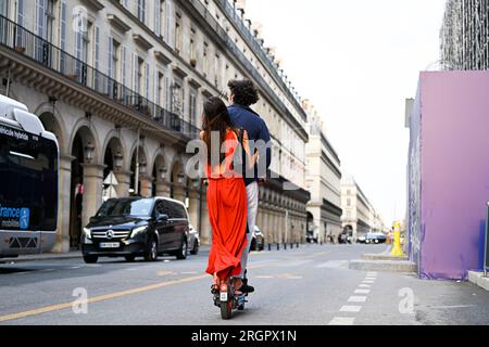 Paris, France. 08th Aug, 2023. Illustration picture shows people using a self-service electric scooter in streets of Paris, France on August 8, 2023. All self-service e-scooters will come to a stop in Paris as of 1 September after a referendum. Credit: Victor Joly/Alamy Live News Stock Photo