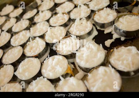 https://l450v.alamy.com/450v/2rgr290/home-made-thai-coconut-pancakes-kanom-krok-made-by-locals-in-ko-yao-island-in-south-thailand-2rgr290.jpg