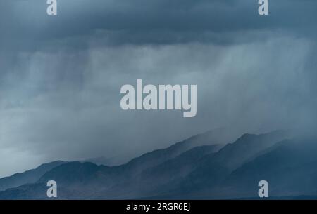 Dark storm clouds over the mountains Stock Photo