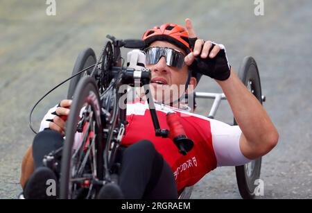 Switzerland’s Tobias Lotscher crosses the finish line in the Men’s H4 Road Race on day nine of the 2023 UCI Cycling World Championships in Dumfries, Scotland. Picture date: Friday August 11, 2023. Stock Photo