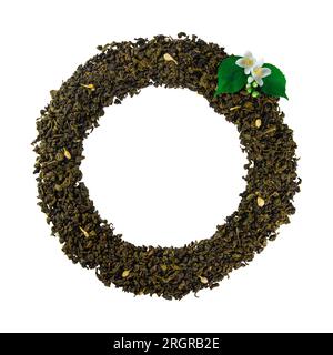 Mockup of dried tea leaves and fresh jasmine flowers shaped in round Frame isolated on white background with clipping path Stock Photo