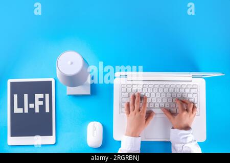 Li-Fi fast internet wireless connection concept, new lightening device, LED lamps energy-efficient data transmission communication technology. Unrecog Stock Photo