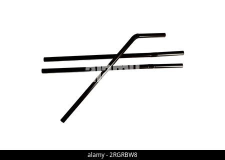 Black plastic single-use straws for beverage drink isolated closeup white background. Stock Photo