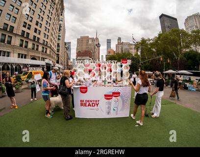 Brand activation for Colgate Total Plaque Pro-Release toothpaste in Flatiron Plaza in New York on Tuesday, August 8, 2023. The promotion for their plaque removing toothpaste revolves around “Totally Honest” referencing the lies people tell their dentists about their oral hygiene. Colgate is a brand of the Colgate-Palmolive Company. (© Richard B. Levine) Stock Photo