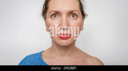 Portrait of a beautiful charming woman over a white background. Portrait Wide Angle Camera Stock Photo