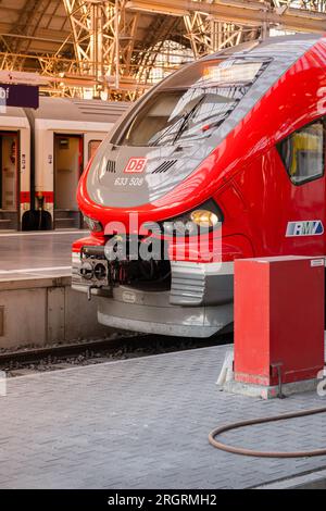 Red modern Deutsche Bahn train at the station. Beautiful train close-up. Stock Photo