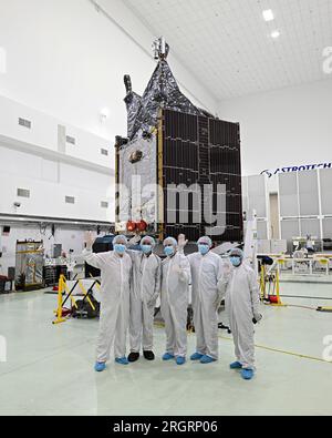 Program Managers stand in front of the NASA Psyche satellite as it is prepared at the Astrotech facility just outside the Kennedy Space Center, Florida on Friday, August 11, 2023. NASA plans to launch Psyche on a SpaceX Falcon Heavy in early October. The satellite will fly on a six year journey to explore the 'metal rich' asteroid of the same name. Photo by Joe Marino/UPI Credit: UPI/Alamy Live News Stock Photo