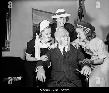 Washington, D.C.:  May 19, 1938 Vice President John Nance Garner was in fine fettle as he greeted visiting South Carolina azalea beauty queens. L-R: Elizabeth West, 1937 Azalea Queen; Margaret Lyon, 'Miss Charleston' of this year; and Dorothy Moore, Azalea Queen of 1938. Stock Photo