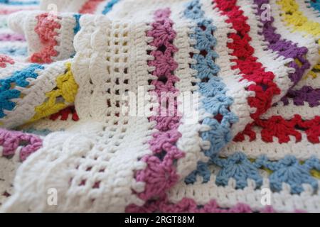 Folds of crocheted fabric, close-up selective focus. Stock Photo