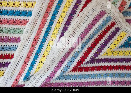 Knitted striped plaid in a bright color. Stock Photo