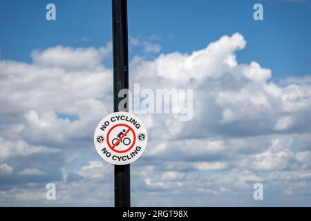 Close and selective focus on a No cycling sign on a lamp post Stock Photo