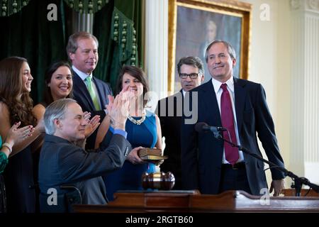 Austin, TX, USA. 5th Jan, 2015. Elected Texas Attorney General KEN PAXTON is sworn into office by Governor GREG ABBOTT on January 5, 2015. Paxton, now on leave from his post after 8 years in office, is facing impeachment charges in the Texas Senate in September for alleged abusing his office for personal gain. (Credit Image: © Bob Daemmrich/ZUMA Press Wire) EDITORIAL USAGE ONLY! Not for Commercial USAGE! Stock Photo