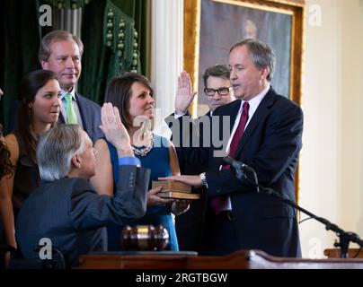 Elected Texas Attorney General KEN PAXTON is sworn into office by Governor GREG ABBOTT on January 5, 2015.  Paxton, now on leave from his post after 8 years in office, is facing impeachment charges in the Texas Senate in September for alleged abusing his office for personal gain. ©Bob Daemmrich Stock Photo