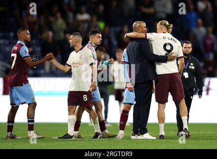 Burnley manager Vincent Kompany greets Manchester City's Erling Haaland following the Premier League match at Turf Moor, Burnley. Picture date: Friday August 11, 2023. Stock Photo