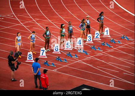 OSTRAVA, CZECHIA, JUNE 27, 2023: Women Sprinters Prepare for 100m Hurdles Race Commencement in Track and Field Championship for Worlds in Budapest and Stock Photo