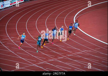 OSTRAVA, CZECHIA, JUNE 27, 2023: Focused Runners in Action: Men Participate in 200m Sprint at Track and Field Championship for Worlds in Budapest and Stock Photo