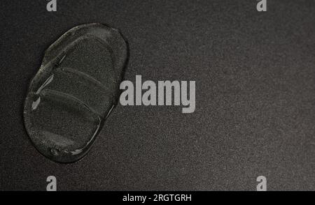 Drop of gel on black background Stock Photo