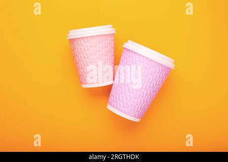 Colored cardboard coffee cups on a bright background Stock Photo