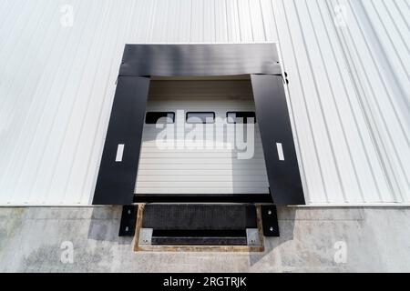 Warehouse gate for loading and unloading cargo in a distributed center Stock Photo