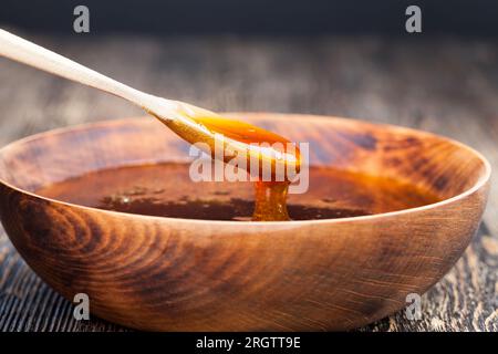 natural viscous honey, which is produced by honey bees, honey is packaged and used in food because it contains a large amount of carbohydrates and is Stock Photo