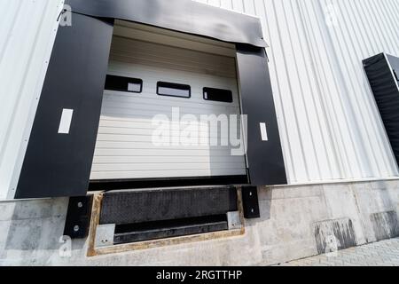 Warehouse gate for loading and unloading cargo in a distributed center Stock Photo