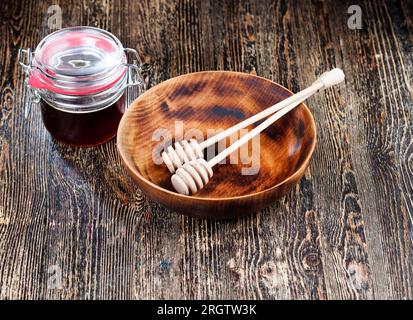 simple and self made ladle honey spoon is made of wood without sanding and processing, there are irregularities on the honey spoon, but it can still b Stock Photo