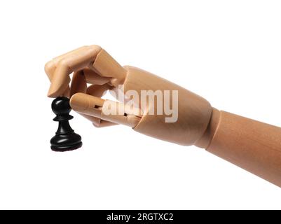 Robot with pawn isolated on white. Wooden hand representing artificial intelligence playing chess Stock Photo