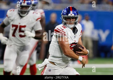 New York Giants quarterback Tommy DeVito (5) avoids Detroit Lions