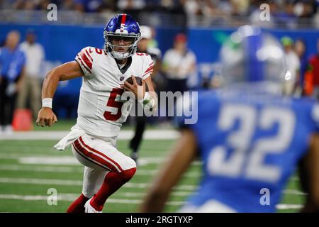 New York Giants quarterback Tommy DeVito (5) avoids Detroit Lions