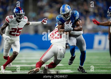 Detroit Lions running back Devine Ozigbo (30) watches from the sideline  during an NFL preseason football game against the Carolina Panthers,  Friday, Aug. 25, 2023, in Charlotte, N.C. (AP Photo/Brian Westerholt Stock