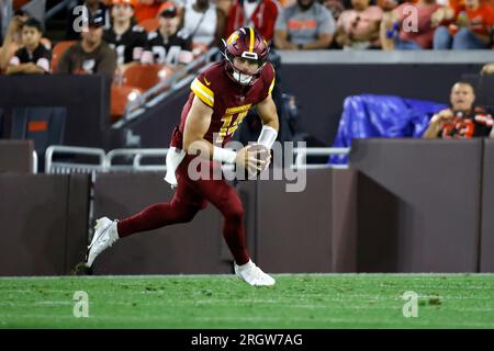 Washington Commanders quarterback Sam Howell (14) warms up prior to the  start of an NFL pre-season football game against the Cleveland Browns,  Friday, Aug. 11, 2023, in Cleveland. (AP Photo/Kirk Irwin Stock