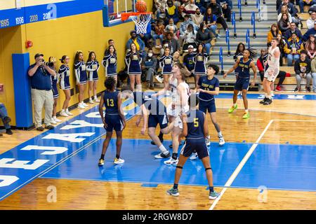 Central Noble and Hammond Noll players await the rebound after a shot in a high school basketball game in North Judson, Indiana, USA. Stock Photo