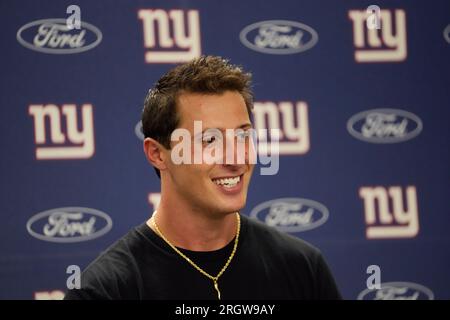 New York Giants quarterback Tommy DeVito (5) avoids Detroit Lions