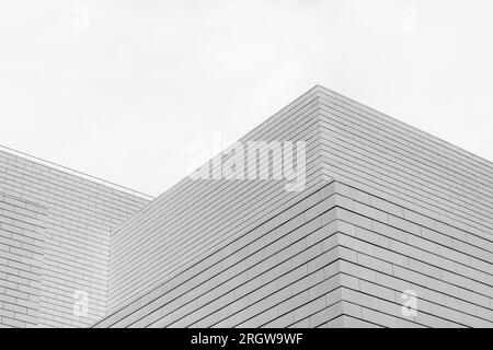 Black and white tone, Abstract architectural detail of modern white clean ceramic tiles with running bonds pattern facade. Stock Photo