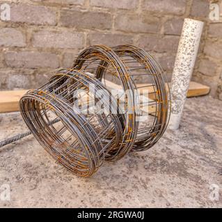 welded wire mesh used in construction to reinforce concrete slab, wood trusses in the background Stock Photo