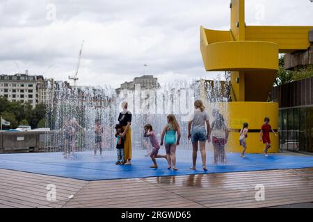 London, UK. 11th Aug, 2023. Kids have fun at the fountain area outside Southbank Centre amid the hot weather caused by the mini-heat wave after storm Antoni last week. Credit: SOPA Images Limited/Alamy Live News Stock Photo