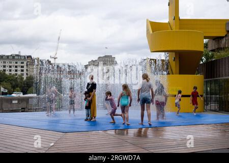 London, UK. 11th Aug, 2023. Kids have fun at the fountain area outside Southbank Centre amid the hot weather caused by the mini-heat wave after storm Antoni last week. (Photo by Hesther Ng/SOPA Images/Sipa USA) Credit: Sipa USA/Alamy Live News Stock Photo