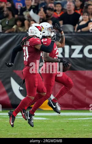 Arizona Cardinals cornerback Antonio Hamilton Sr., right, celebrates after  intercepting a pass with safety Andre Chachere during the second half of an  NFL preseason football game against the Denver Broncos in Glendale