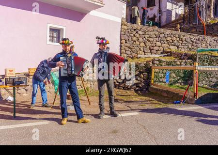 Valfloriana, Italy - February 26, 2022: Carnival participants play music, in the Valfloriana carnival, Trentino, Northern Italy Stock Photo