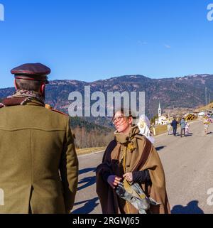 Valfloriana, Italy - February 26, 2022: Carnival participants in traditional costumes, and spectators, in the Valfloriana carnival, Trentino, Northern Stock Photo