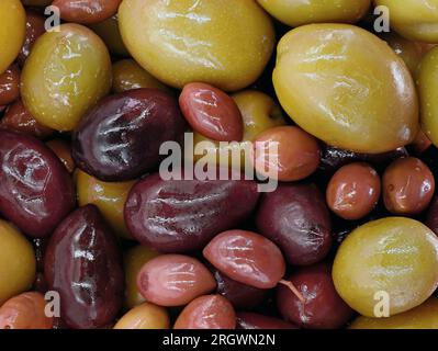 various types of olives in different shapes, colors and sizes, close up of mixed olives Stock Photo