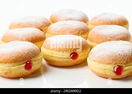 freshly baked jelly donuts on white background Stock Photo
