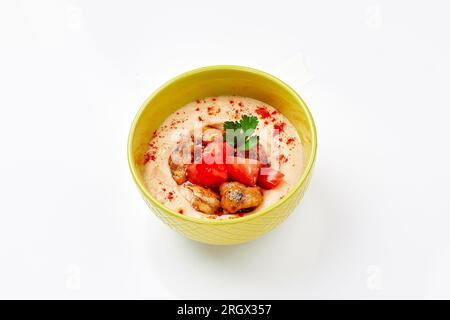 Hummus with chicken. A dish of crushed chickpeas for delivery, or online store. Isolated on a white background Stock Photo