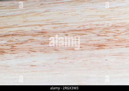 a board made of hevea wood, a light board with a hevea tree structure, from which a board of several boards is made Stock Photo