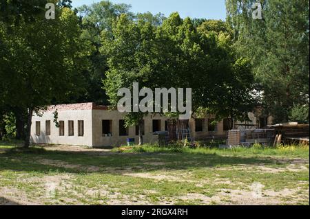 Building without roof. Single-story unfinished building and building materials. Latvia 07.2023. Stock Photo