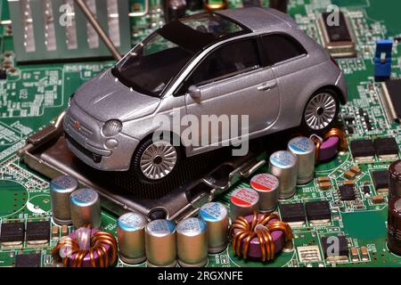 Toy car with CPU. The shortage of microchips and semiconductors creates a shortage of new cars. Conceptual image for semiconductor shortage disrupting Stock Photo
