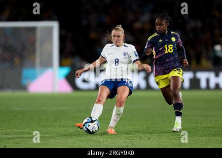 Sydney, Australia, 12 August, 2023. Georgia Stanway of England passes the ball under pressure from Linda Caicedo of Colombia during the Women's World Cup quarter final football match between the England and Colombia at Stadium Australia on August 12, 2023 in Sydney, Australia. Credit: Damian Briggs/Speed Media/Alamy Live News Stock Photo