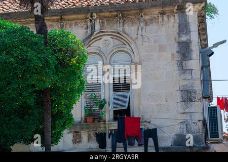 The old town of Sibenik in Croatia. Narrow streets, vintage buildings and windows of old houses. UNESCO worlds heritage site, marble town Sibenik Stock Photo