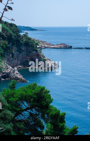 Amazing landscape overlooking a beautiful lagoon, pine forest and wild beach. Wonderful turquoise water of the Adriatic Sea, Mountains are visible on Stock Photo