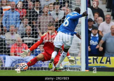 Everton, UK. 12th Aug, 2023. Abdoulaye Doucoure of Everton (16) shoots but sees his effort saved by Bernd Leno, the goalkeeper of Fulham. Premier League match, Everton v Fulham at Goodison Park in Liverpool on Saturday 12th August 2023.this image may only be used for Editorial purposes. Editorial use only, license required for commercial use. No use in betting, games or a single club/league/player publications. pic by Chris Stading/Andrew Orchard sports photography/Alamy Live news Credit: Andrew Orchard sports photography/Alamy Live News Stock Photo